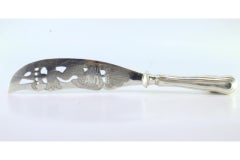 Silver fish knife with engraved fish and crown shape