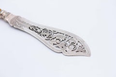 Silver fish knife with scalloped blade