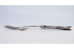 Silver fish serving fork w/ four prongs & engraved handle w/ friezes & scrolls