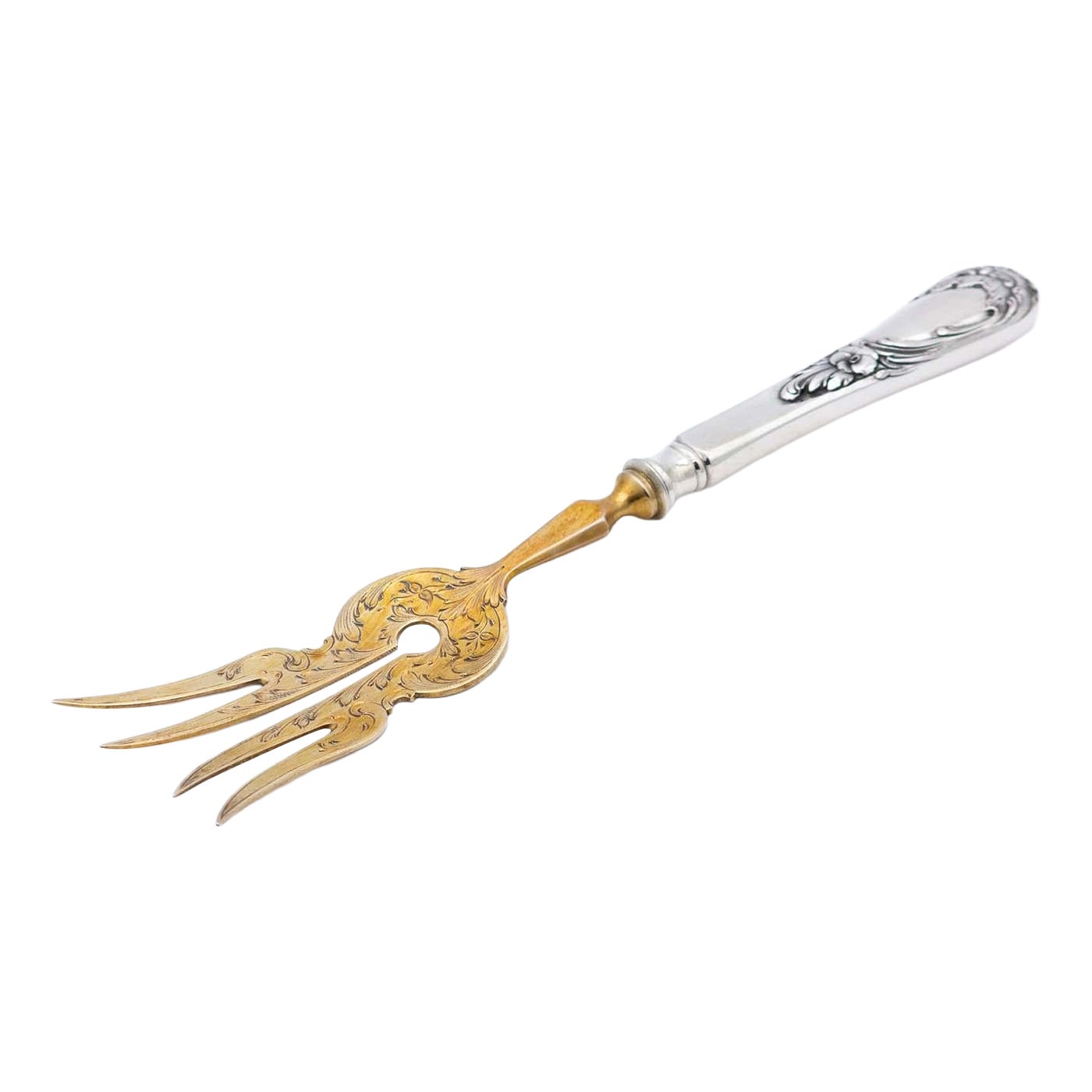 Silver fish serving fork with gold tines and relief on the handle