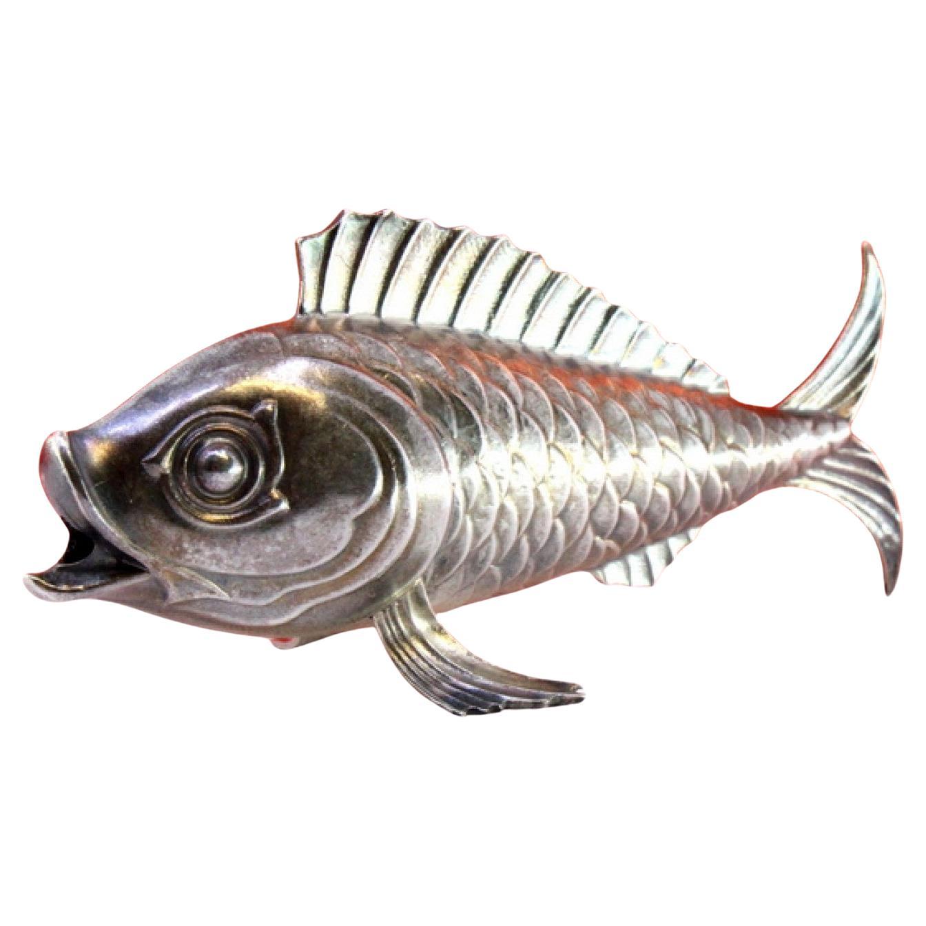 Silver fish-shaped toothpick holder with raised scales on fins