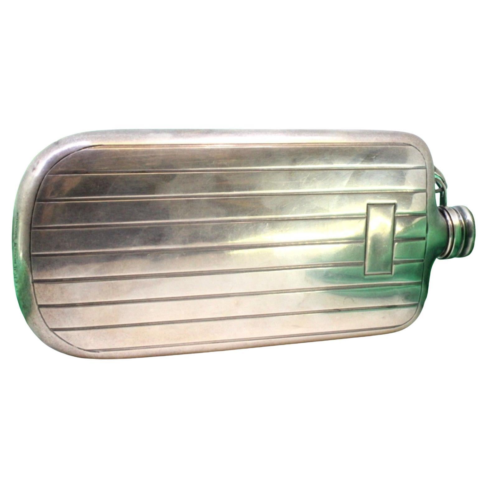 Silver flask w/ bands at the top 
a monogram card in the center 
a screw cap For Sale