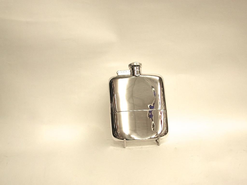 Silver flask with integral cup, dated 1932, Made In Sheffield, James Dixon & Sons
Heavy quality weighing 7.88 troy ounces, with a bayonette fitting on top.
The capacity of this flask is 5/8 ths of a pint.
Nice to have an integral cup which pulls