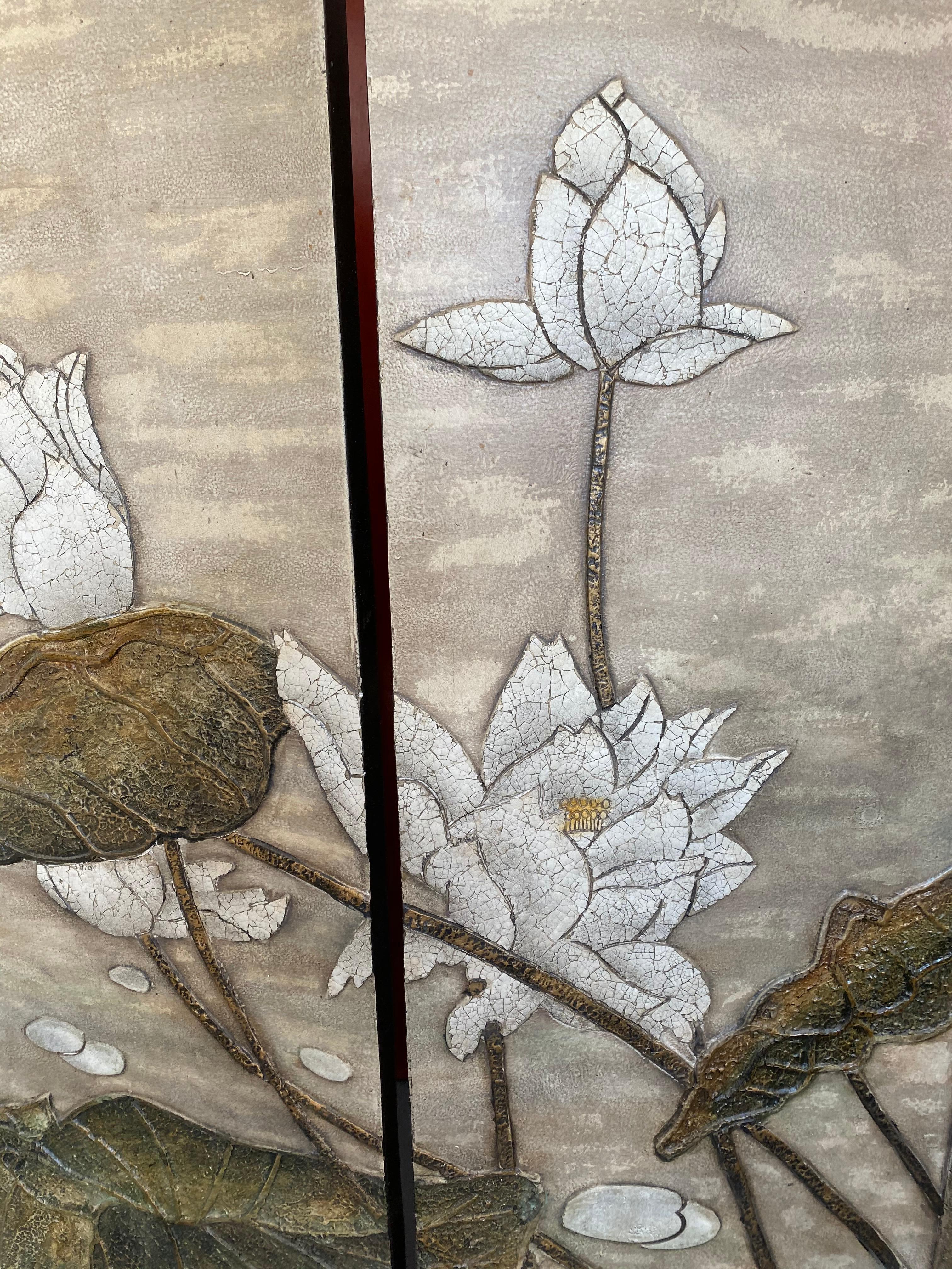 This four-panel floor screen has beautiful water lilies in relief to the front and a silver spotted background on the back. Makes a great room divider.