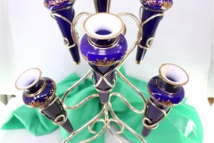 Silver flower box with seven supports, scrolls and three button feet