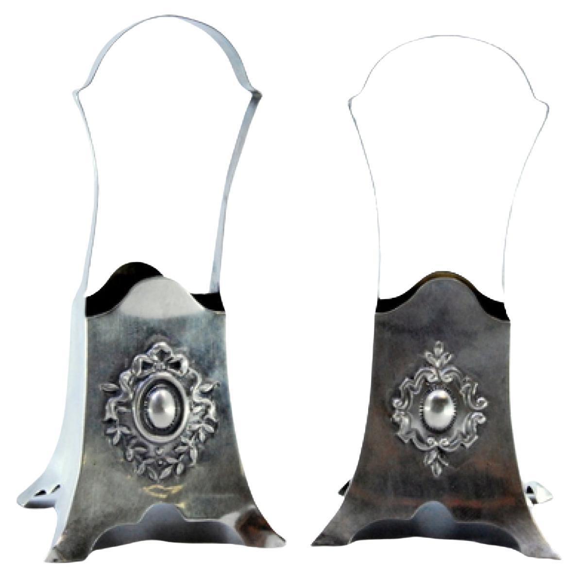 Silver flower boxes/baskets with reliefs in the center and set on four feet