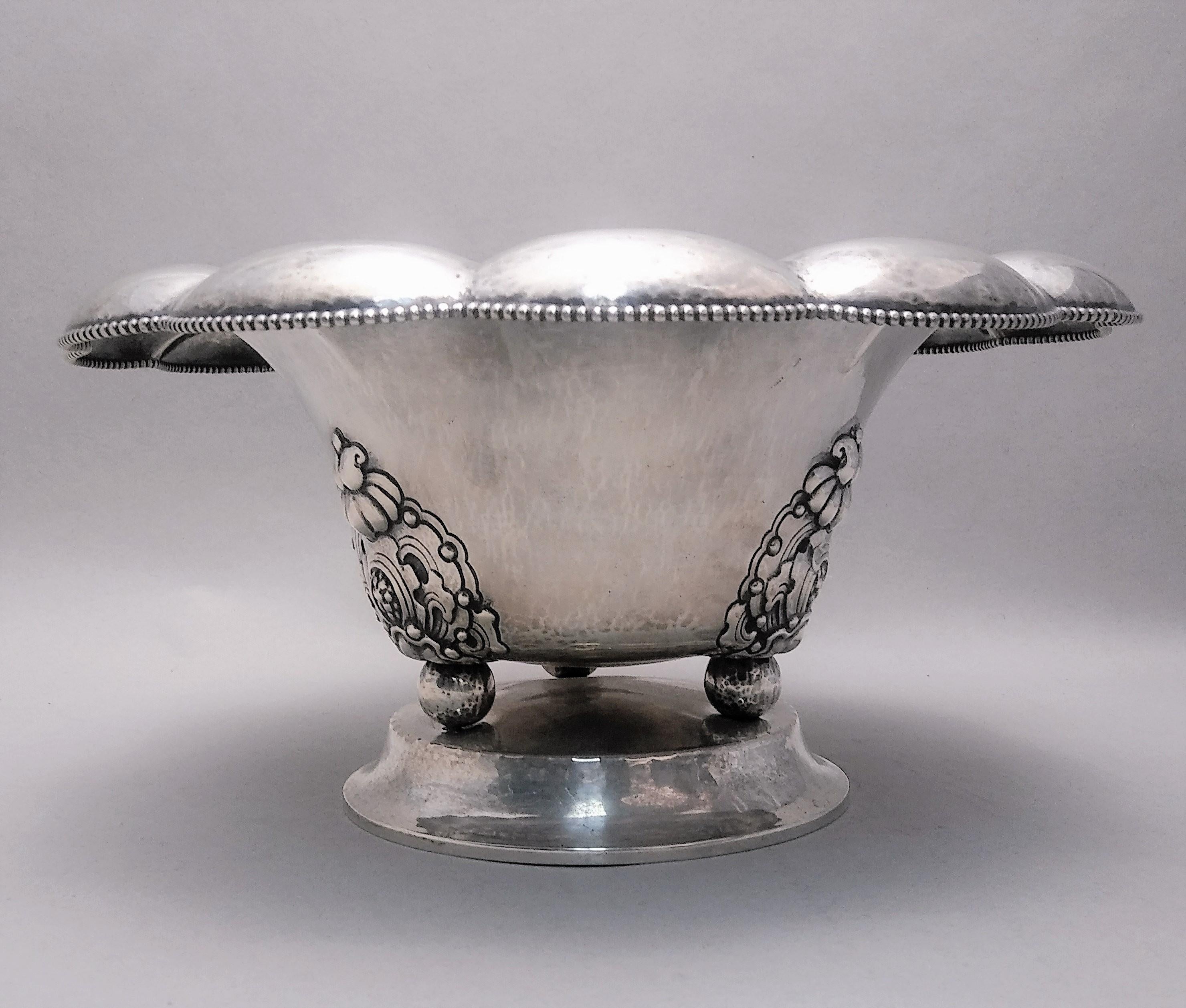 Early 20th century Norwegian 0.830 silver centerpiece by David Andersen. Designed with a beautiful flower border and beading going around. Three flower and leaf pattern around outside of bowl, standing on three balled feet on top of base. Measuring