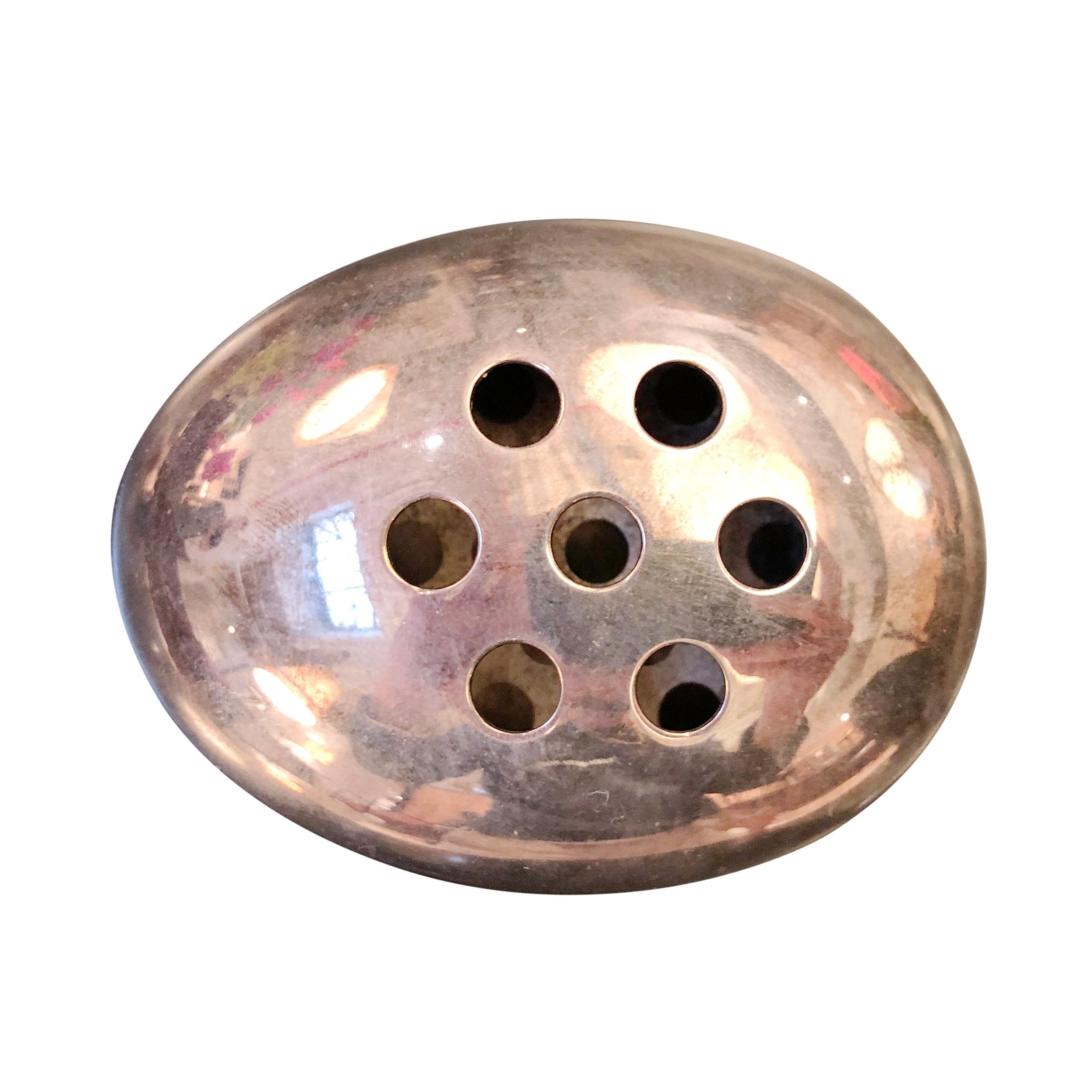 A small silver plated brass flower frog in the form of an egg. Designed and manufactured by Carl Cohr in Denmark, circa 1960s. Pricing per each.