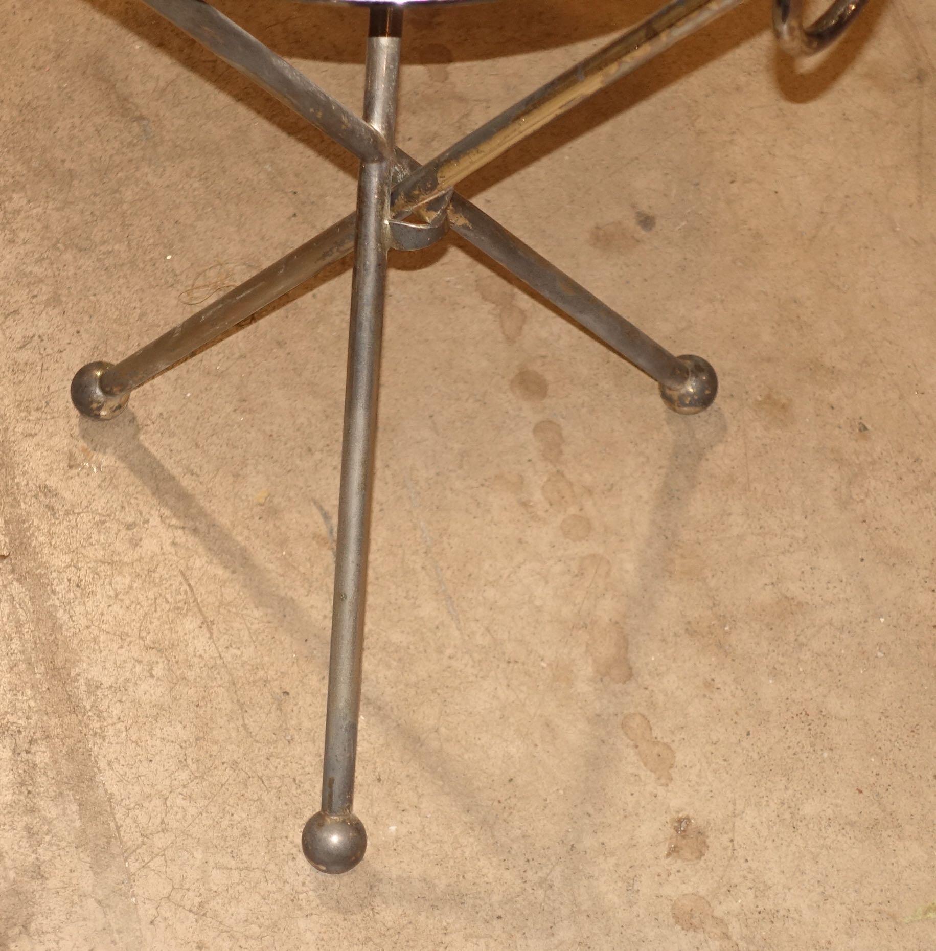 Midcentury Spanish silver plate folding cocktail table
Tripod legs with footed ball detail
Lightweight and sturdy and easy to relocate in a room
Beautiful natural patina.