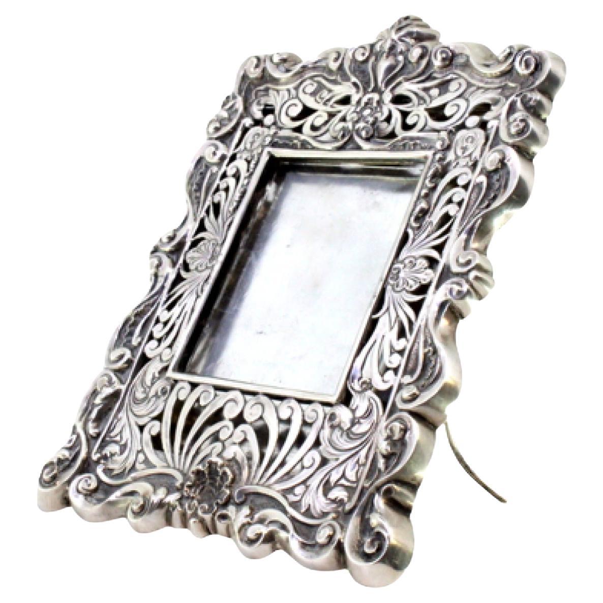 Silver frame cut with shell reliefs and support stand For Sale