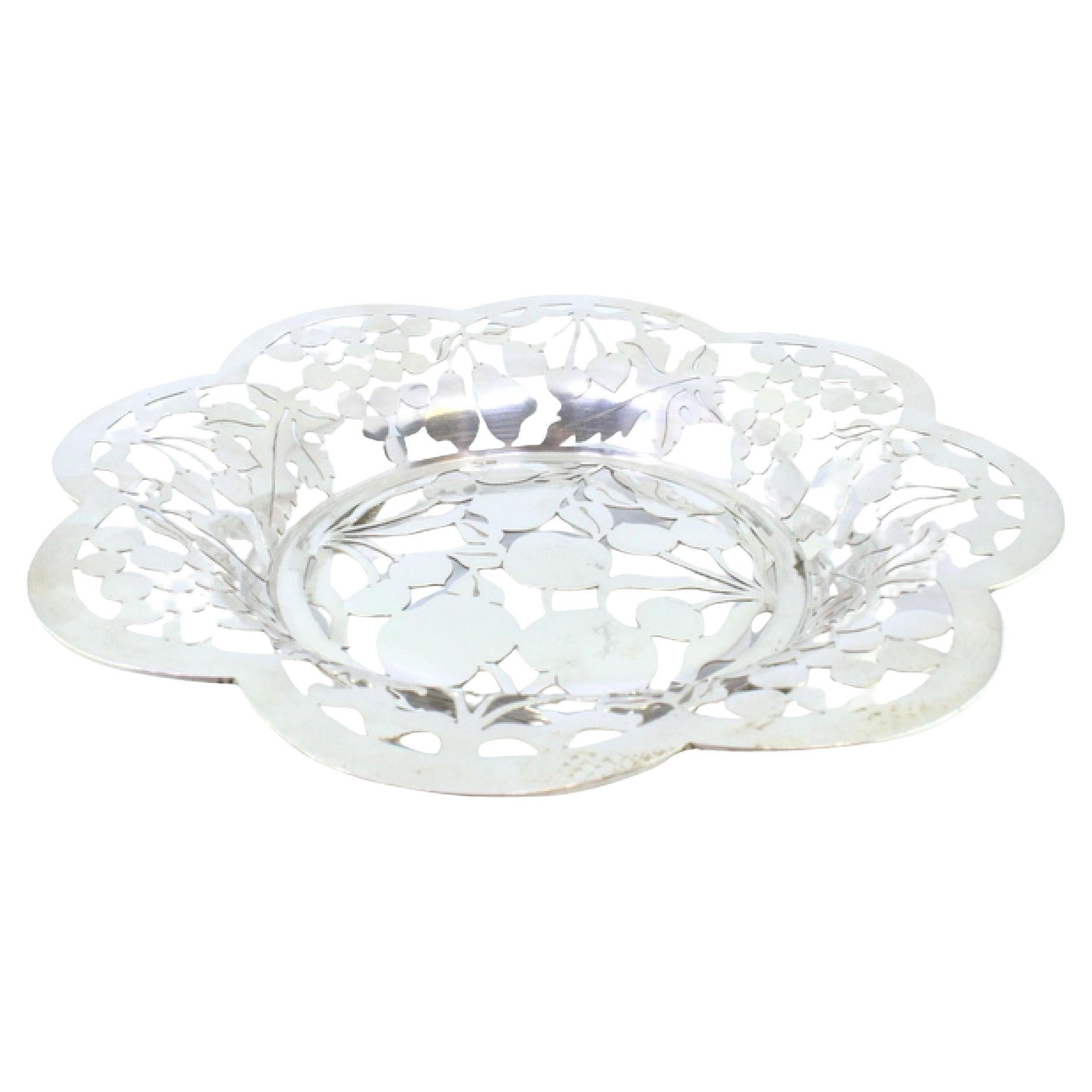 Silver fruit bowl cut into the shape of fruit and resting on four openwork feet