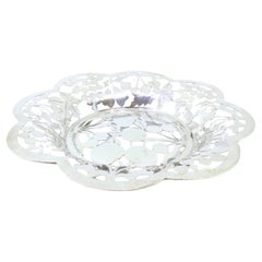 Silver fruit bowl cut into the shape of fruit and resting on four openwork feet Silver fruit bowl cut into the shape of fruit and resting on four openwork feet