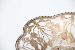 Silver fruit bowl cut out with fruit and leaf shapes