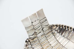 Silver fruit bowl in the shape of a basket