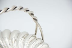 Silver fruit bowl with spiral segments