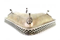 Silver fruit bowl with wire rack on four embossed acanthus feet