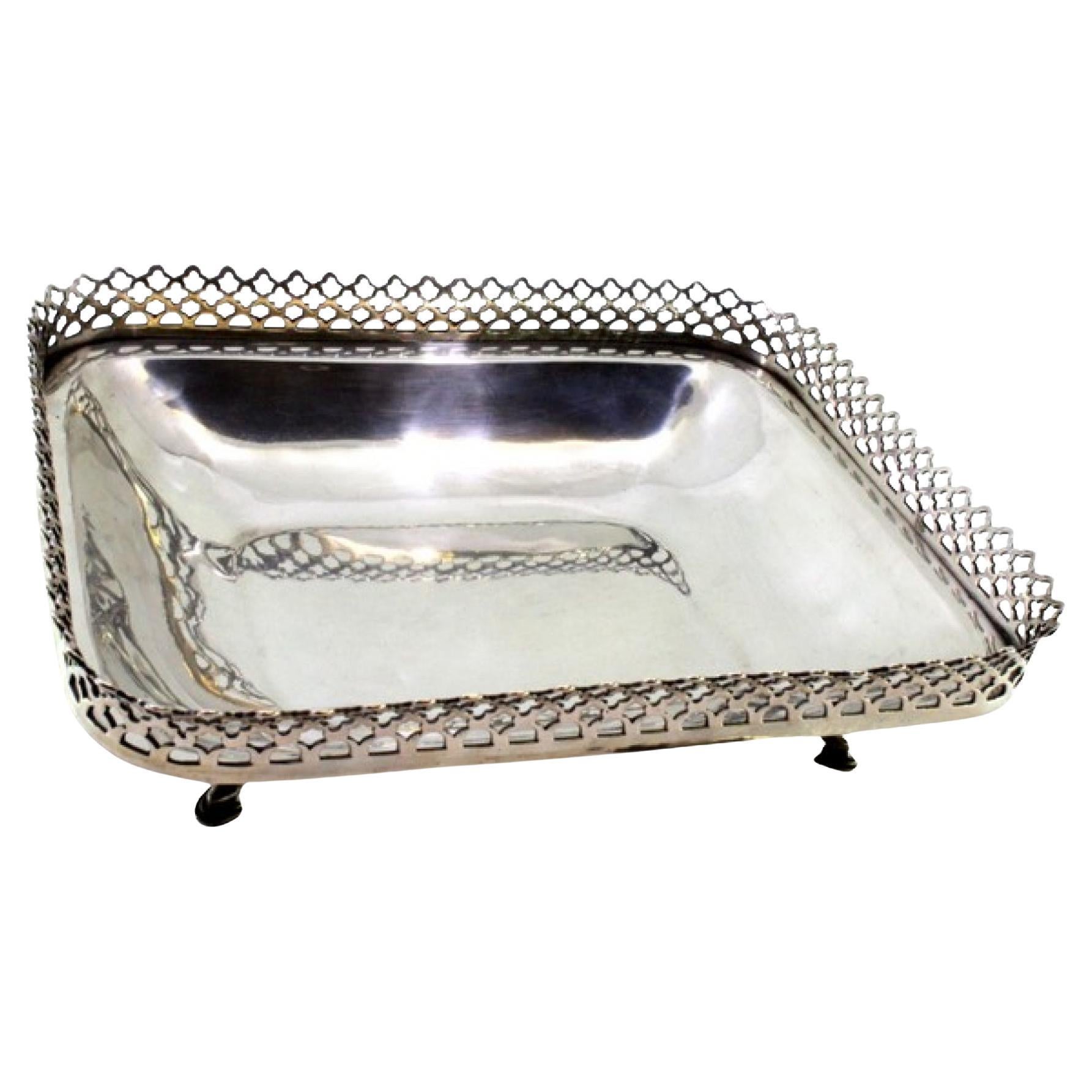 Silver fruit bowl with wire rack on four embossed acanthus feet