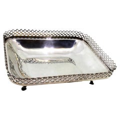 Silver fruit bowl with wire rack on four embossed acanthus feet