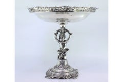 Silver fruit centerpiece with grid, engravings and female support figure