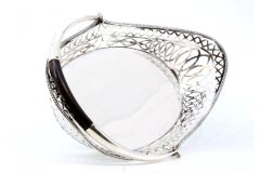 Silver fruit centerpiece with wire rack, wood handle and oval base