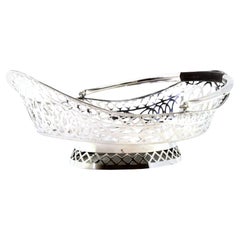 Silver fruit centerpiece with wire rack, wood handle and oval base