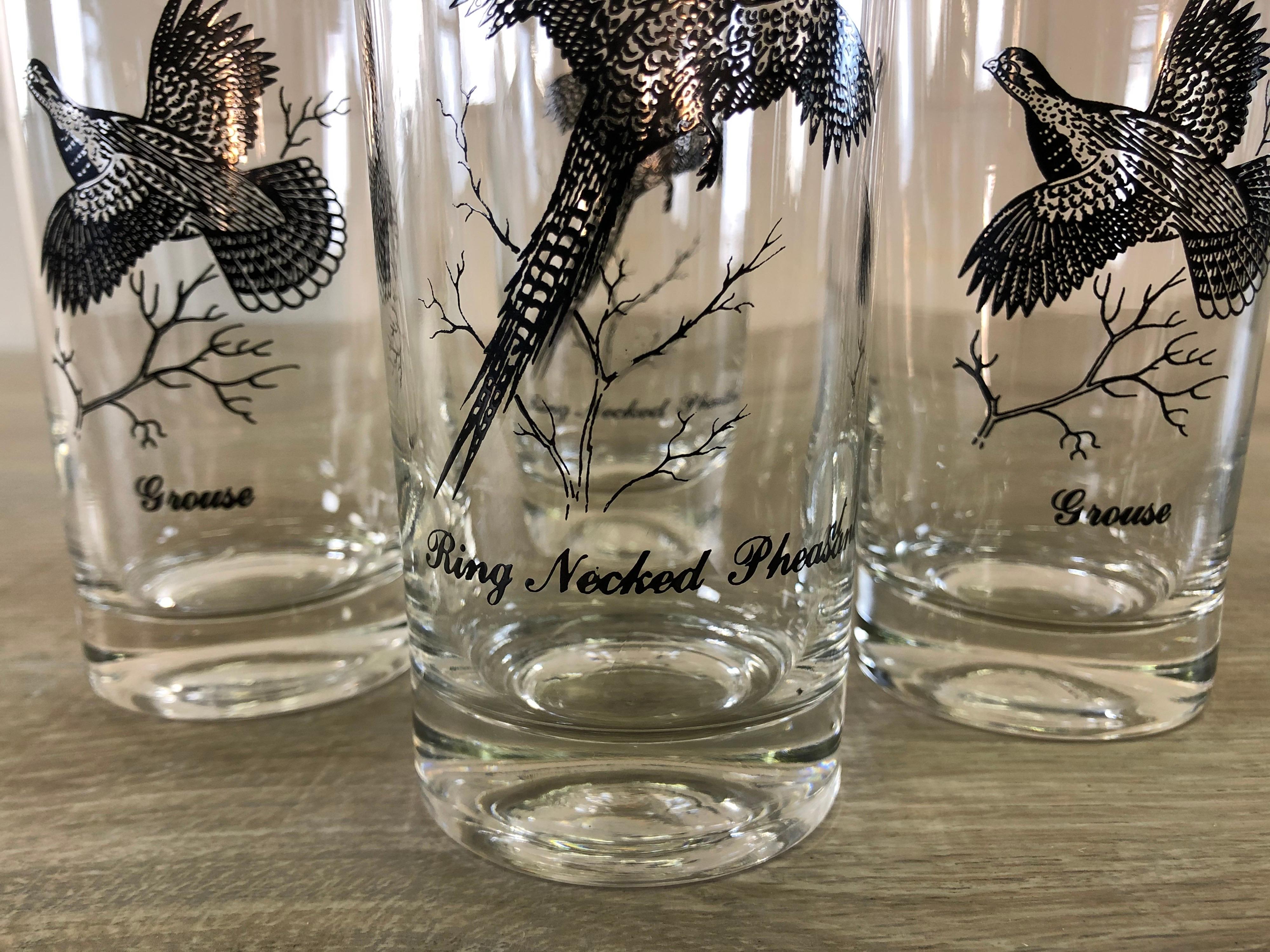 Vintage 1960s set of four silver game bird drinking glasses. Two glasses are pheasant and two are grousse. No marks. All silver is strong.
