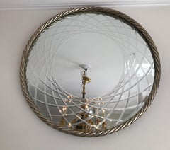 Miroir rond en corde sculptée et dorée à l'argent
