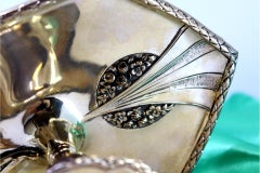 Silver-gilded paddle with embossed floral motifs