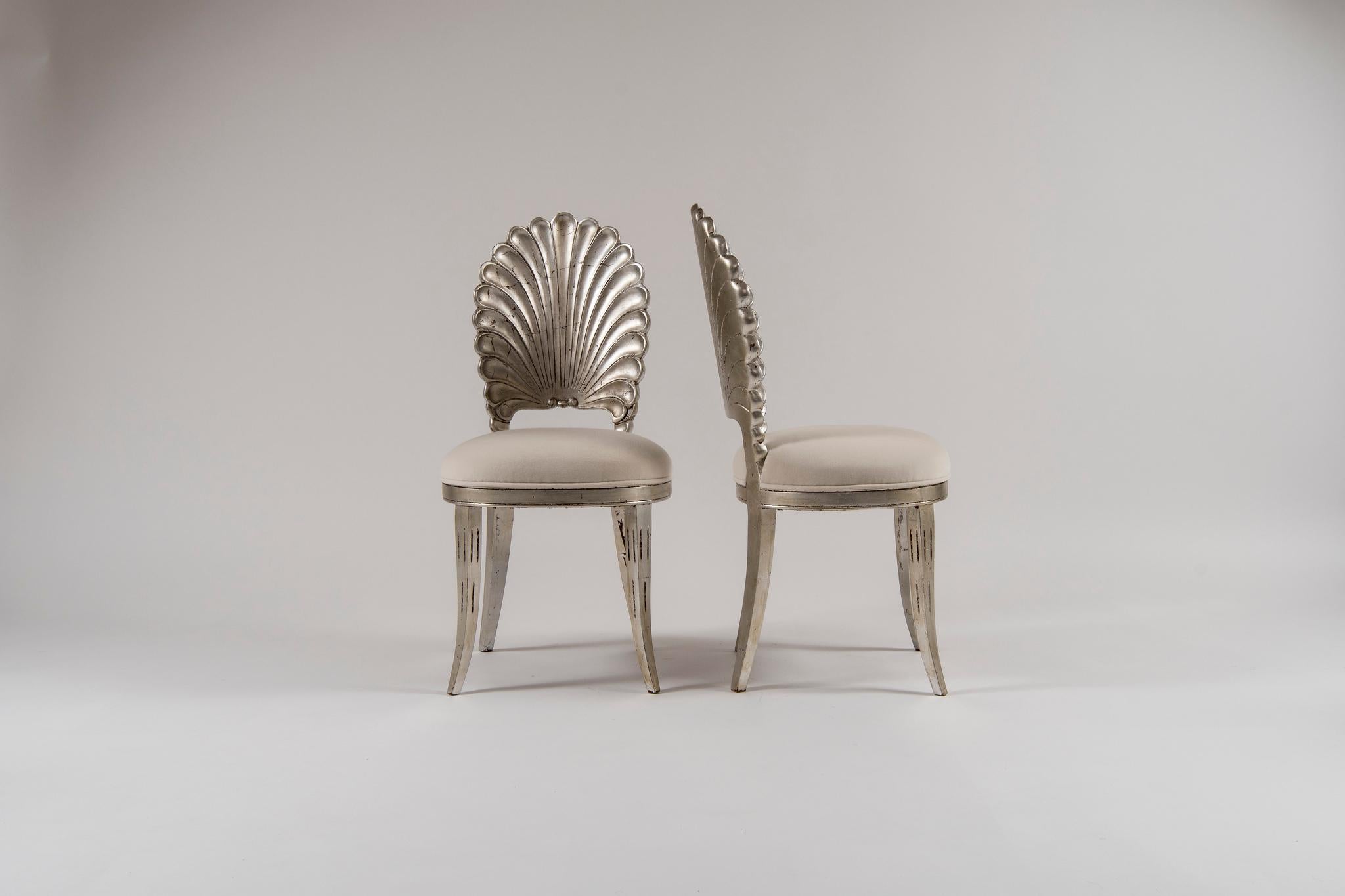 A 20th century silver gilded Italian shell back chair newly upholstered in a white creamy low pile velvet. Two available, sold individually.