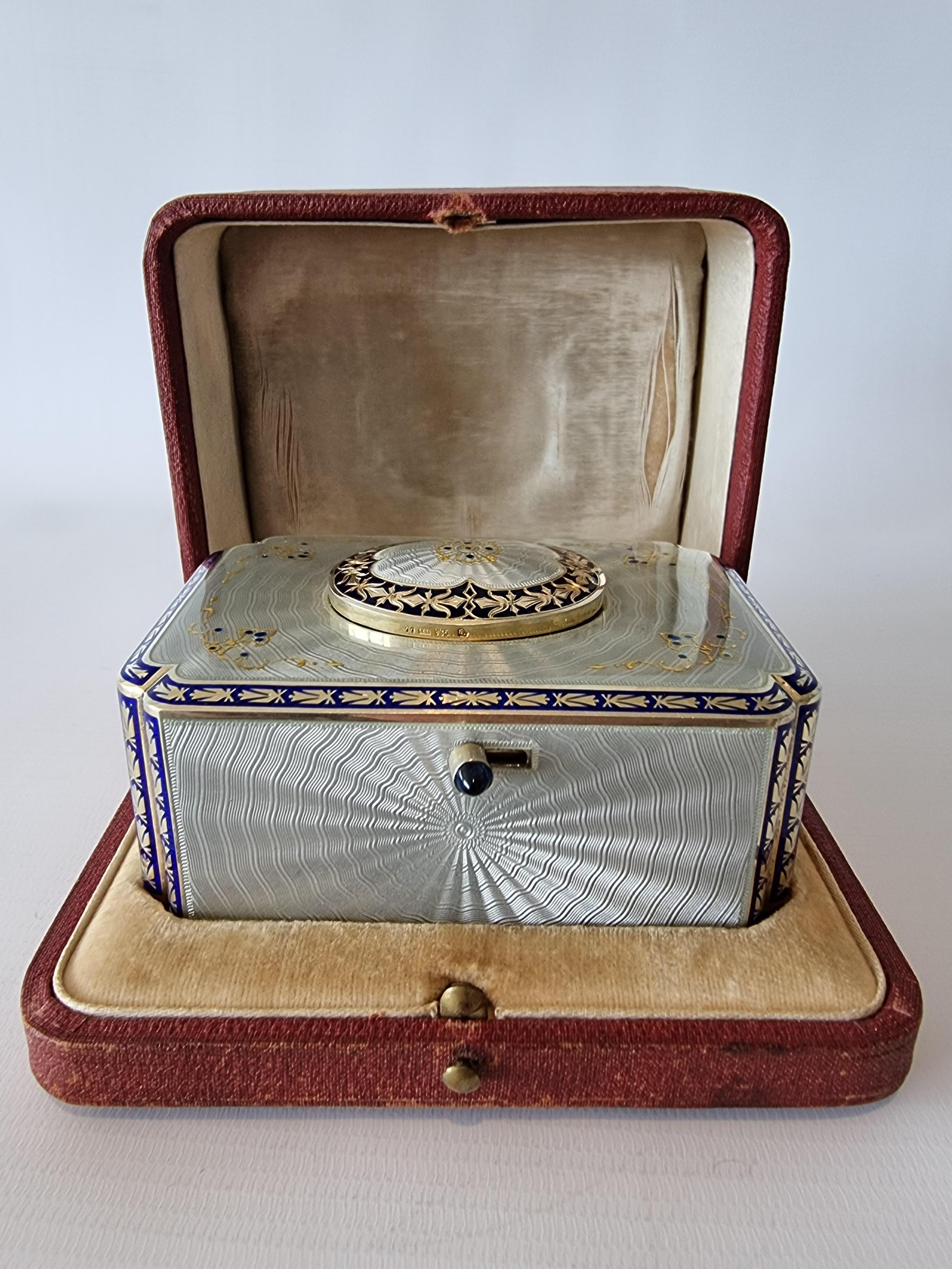 A sublime silver gilt and full radial guilloche enamel with highlights, singing bird box, with original silver and enamel key and original leather carry case. When wound and the bird-form start/stop button actuated, the magic starts immediately with