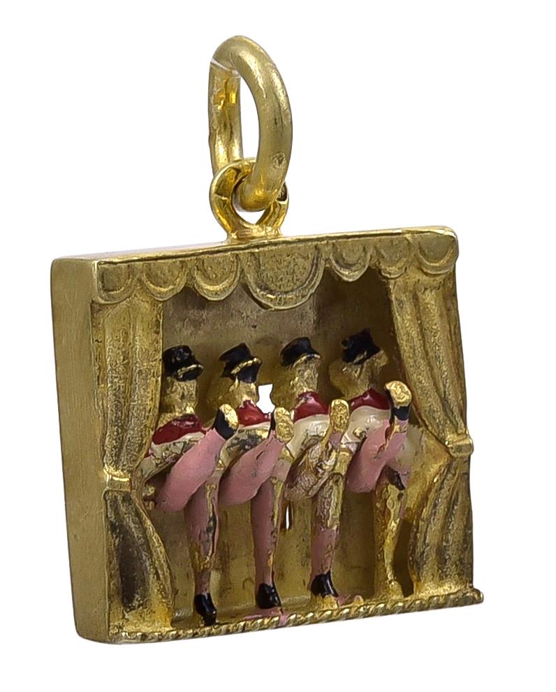 Superb charm:  four figural can-can dancers on a stage.  When you press a lever on the reverse side, the dancers' legs kick up.  Gilt sterling silver, with enamel decoration.   1/2