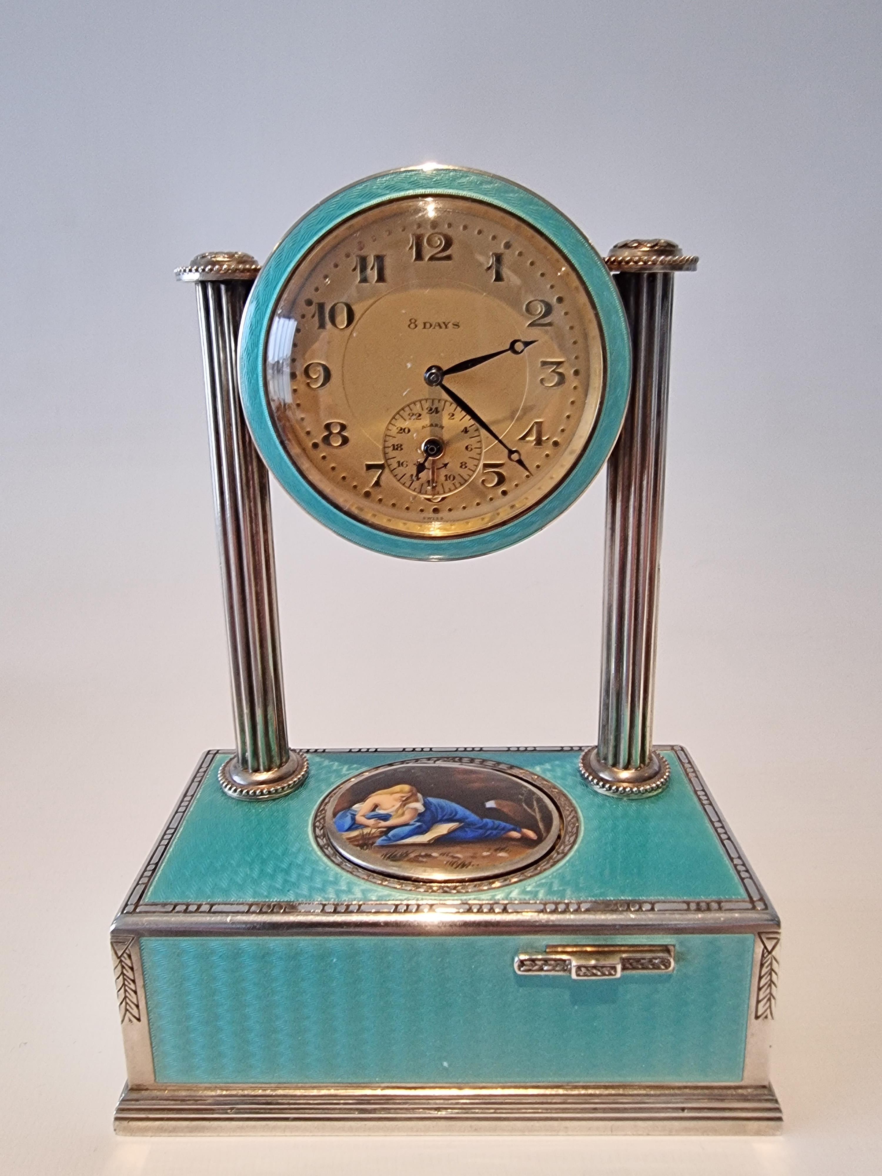 An extremely fine vintage richly-hued silver-gilt, guilloche turquoise enamel and pictorial enamel timepiece alarm-actuated singing bird box, by C. A. Marguerat.
When 8-day clock movement wound and set to the correct time, the alarm train wound and