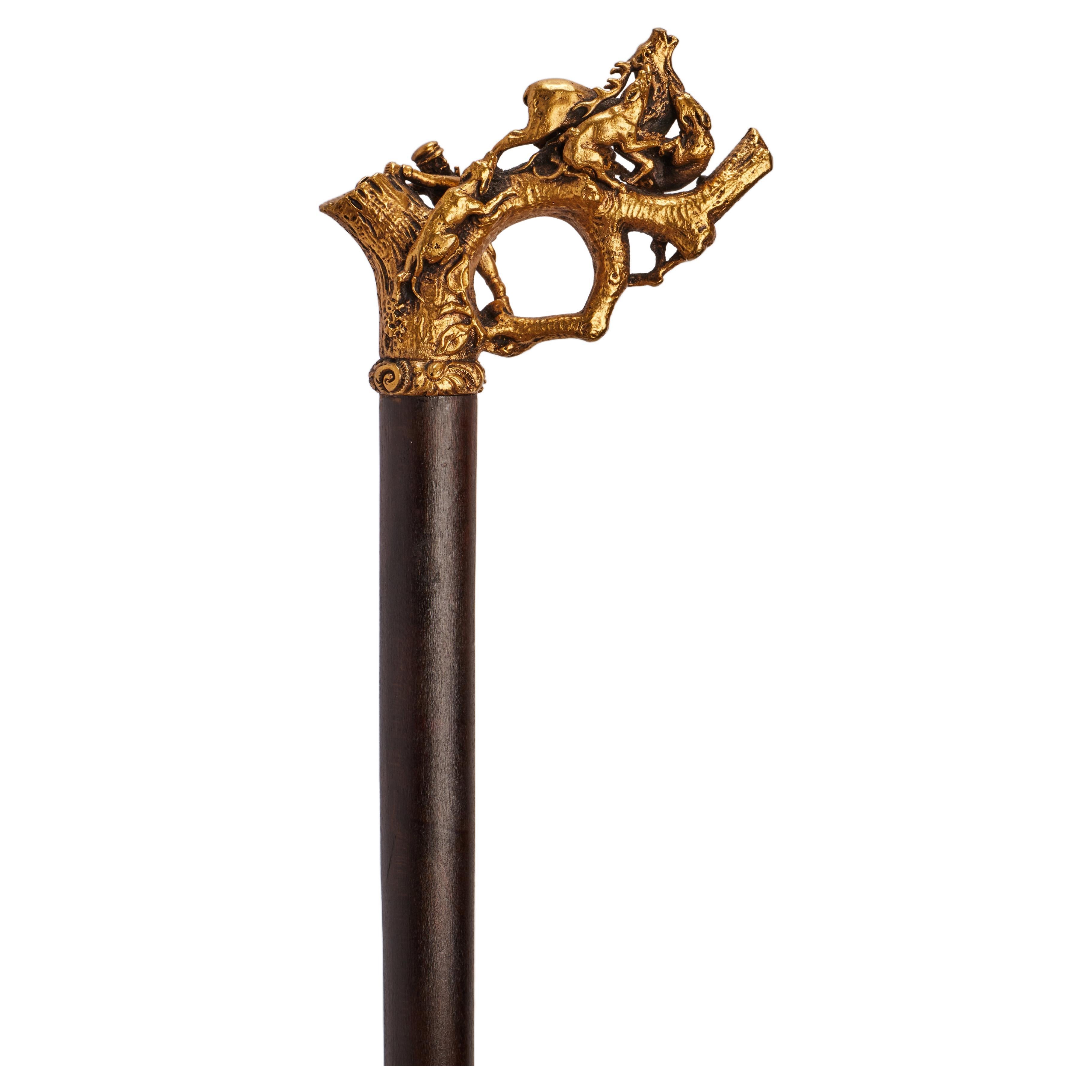 Silver gilt handle walking stick depicting an hunting scene, Germany 1890.  For Sale