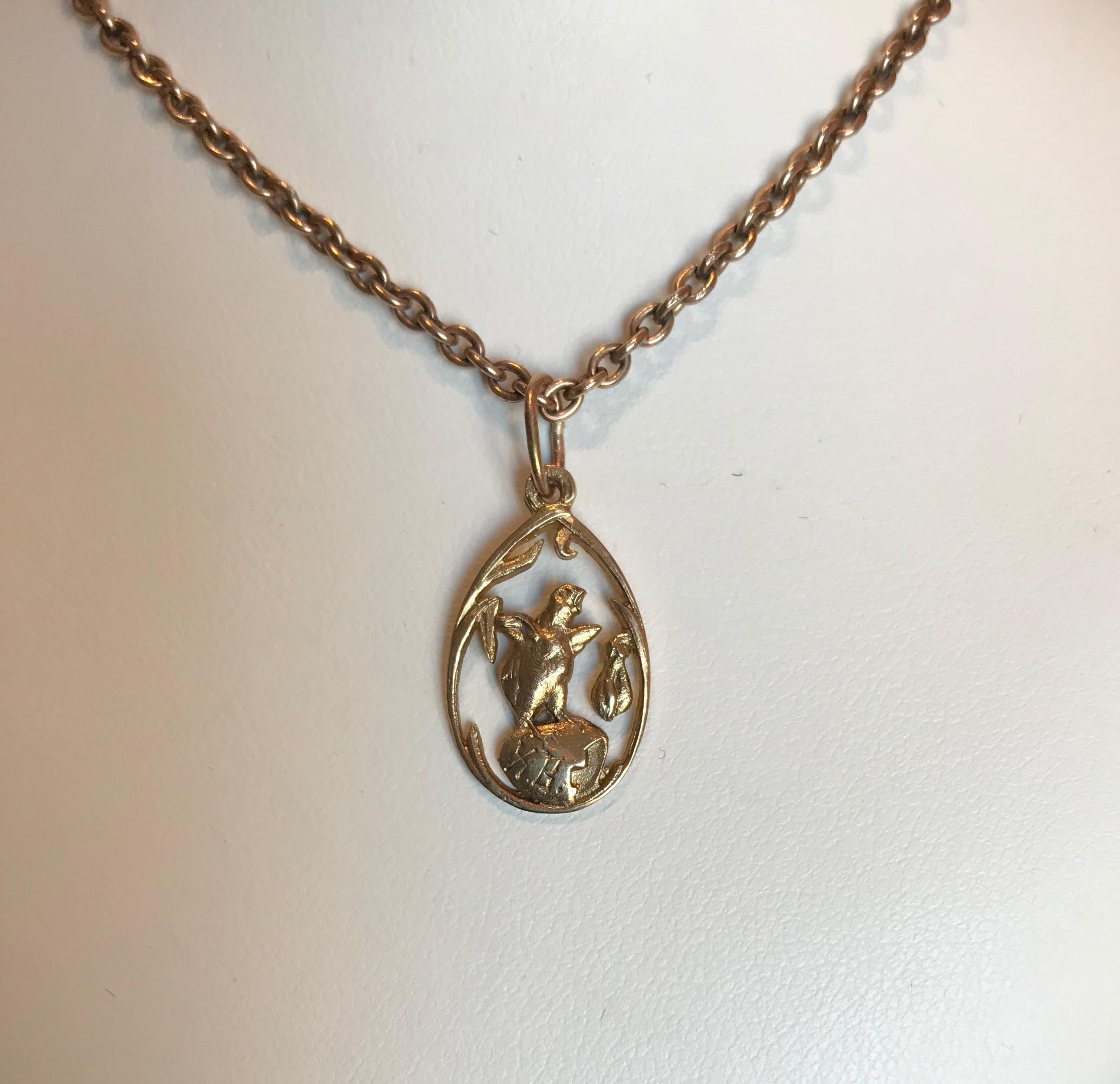 A Russian inspired egg-shaped pendant, of openwork gilded silver or vermeil design depicting a chick emerging from its egg, engraved XB, for Xristos Boskrese, or Christ is Risen in Russian. Only one left.

By Marie Betteley, 2004.

1 in. (2.5 cm.)