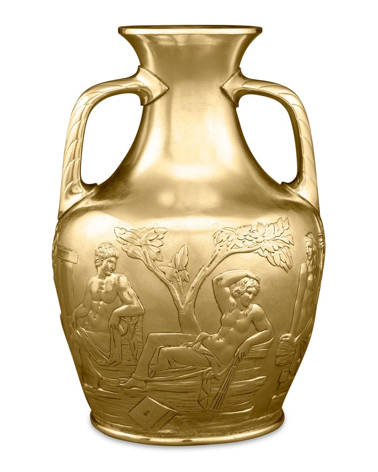 This magnificent silver-gilt Portland vase was crafted by the pioneering silversmithing firm of Elkington & Co. The iconic classical scenes are chased upon a textured background with the utmost precision and are strikingly accurate to the original
