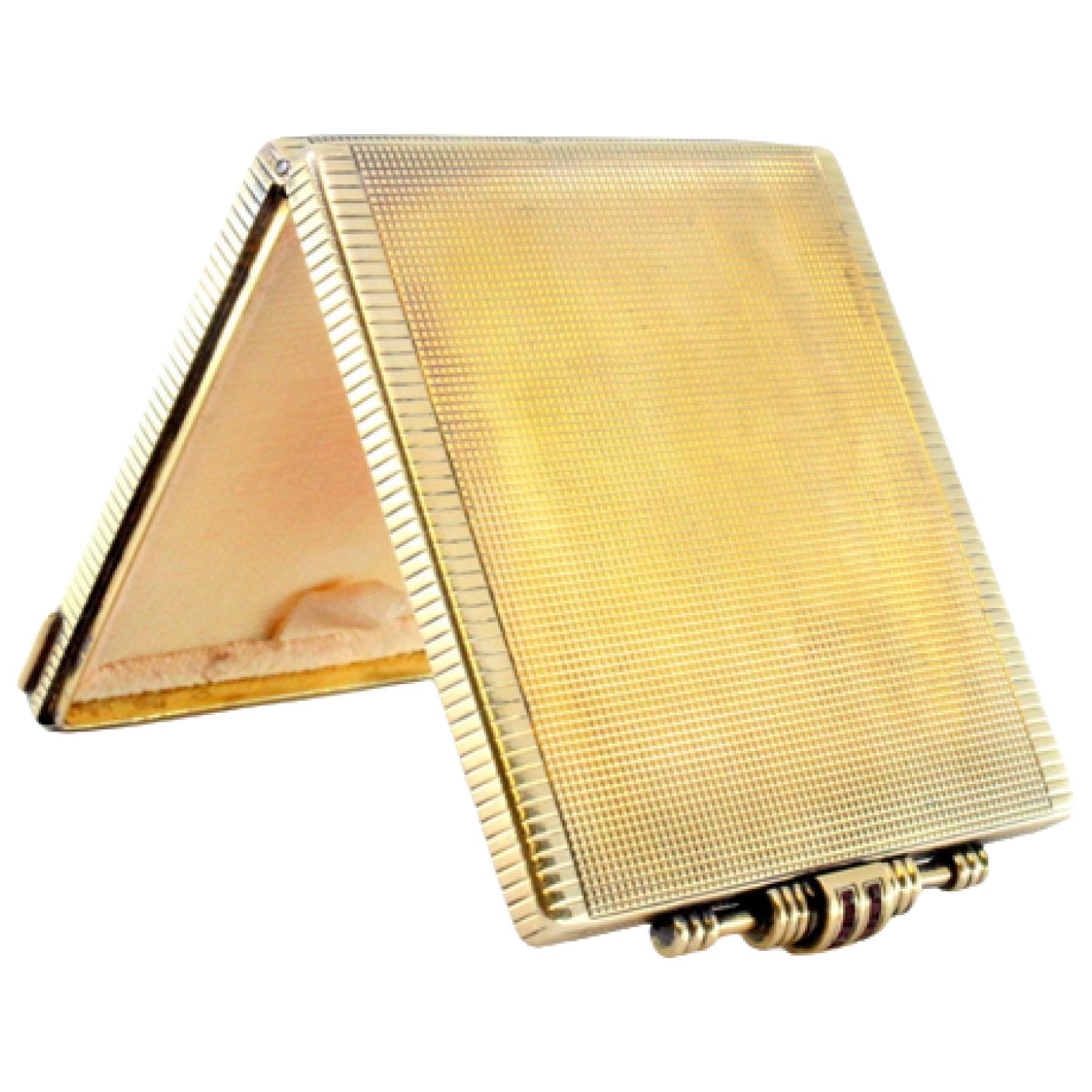 Neceser de plata dorada con relieves en la tapa de espejo y base de polvo con rubí