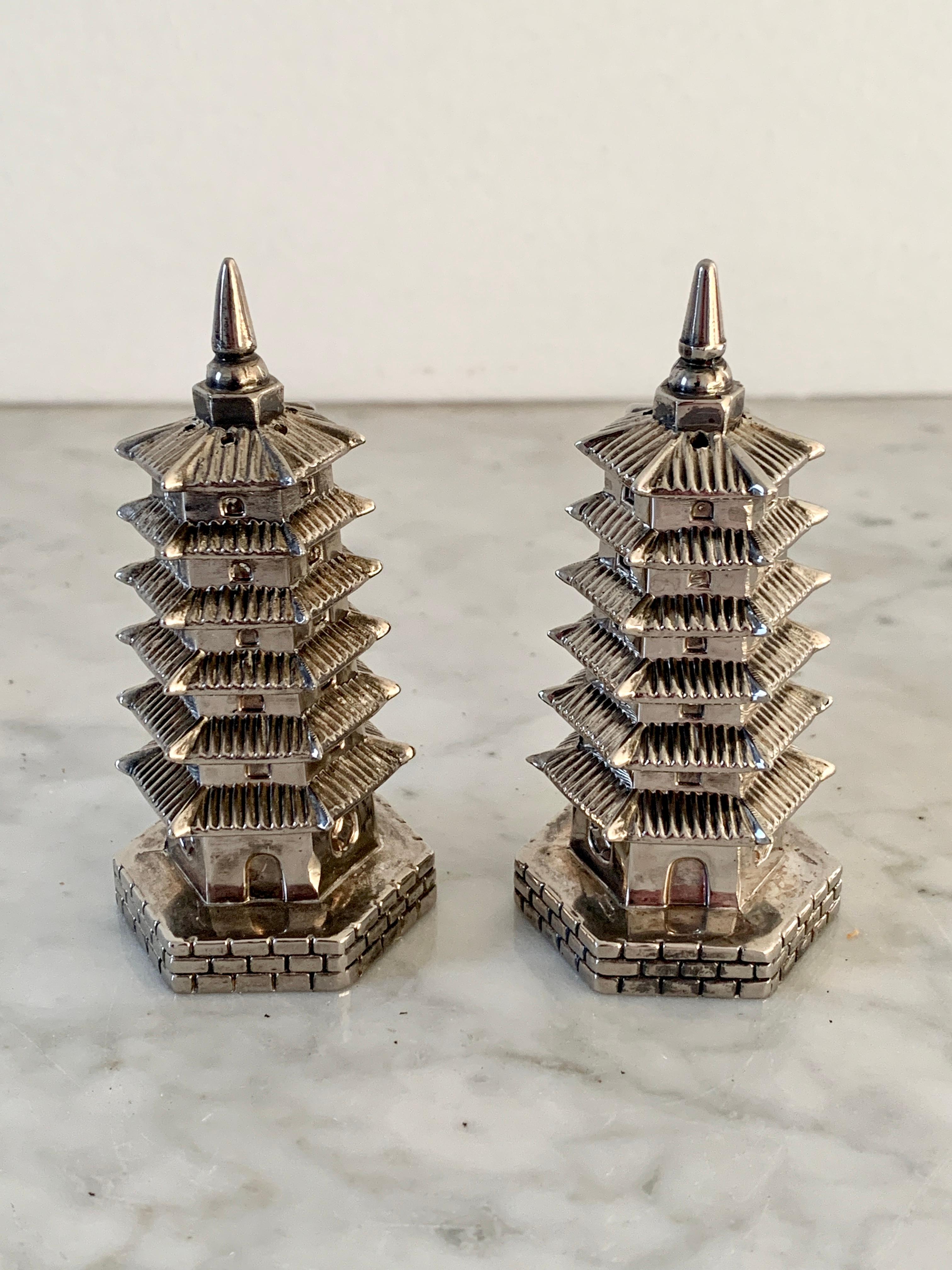 A charming pair of silver plate salt & pepper shakers in the form of pagodas

By Godinger

circa 1970s

Measures: 1.5
