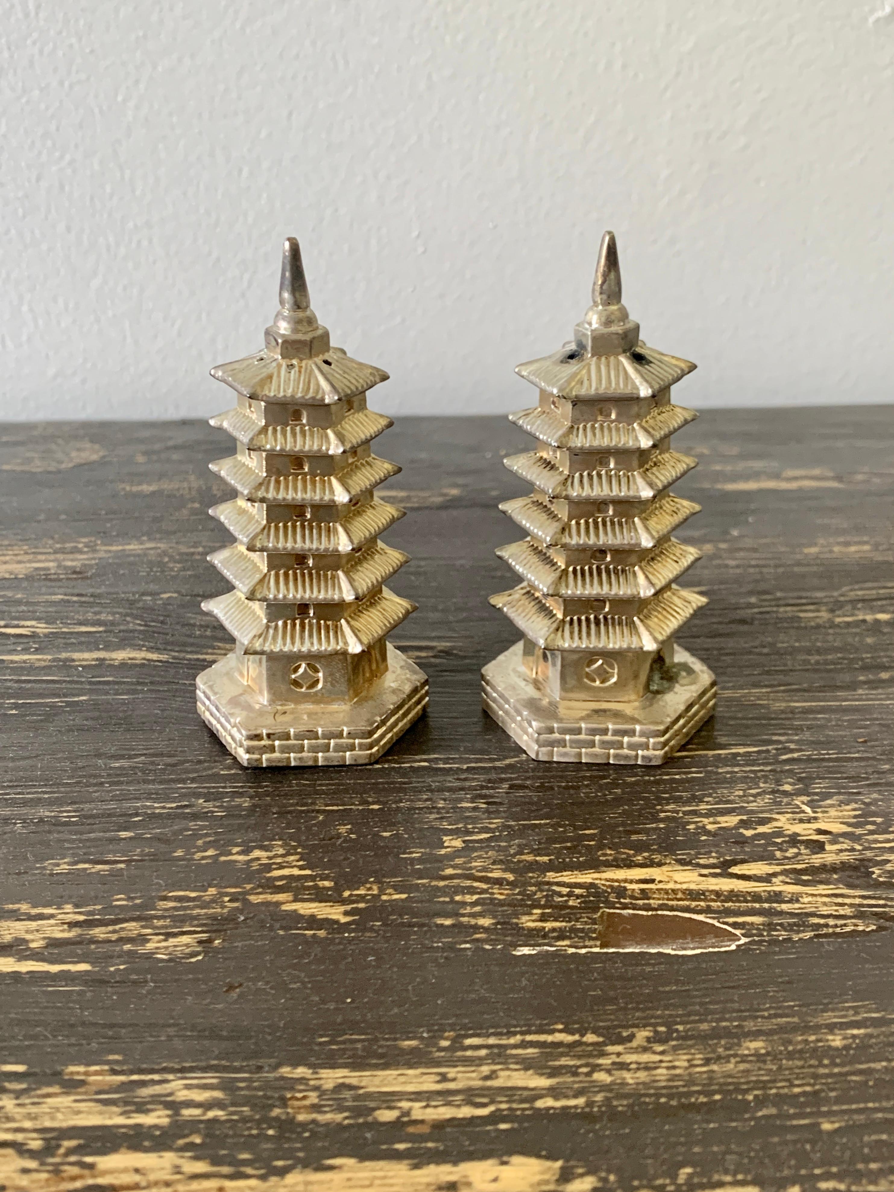A charming pair of silver plate salt & pepper shakers in the form of pagodas

By Godinger

Circa 1970s

Measures: 1.5