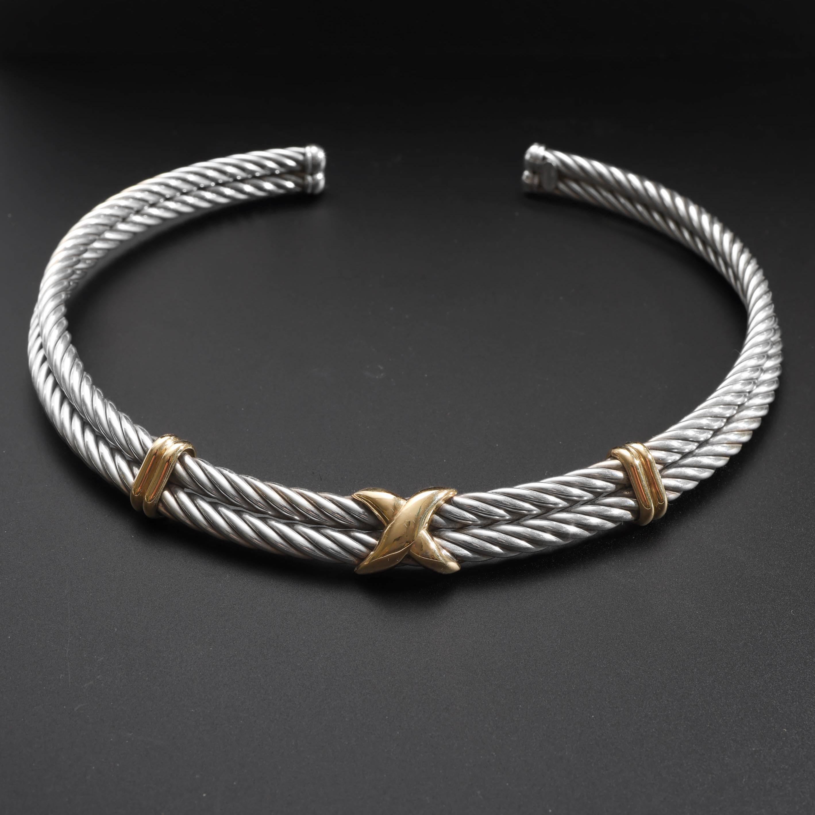 This bold solid sterling silver and 18K yellow gold double-twist choker necklace was created by hand in Italy circa 1990s.

Composed of two 5.5mm thick 16