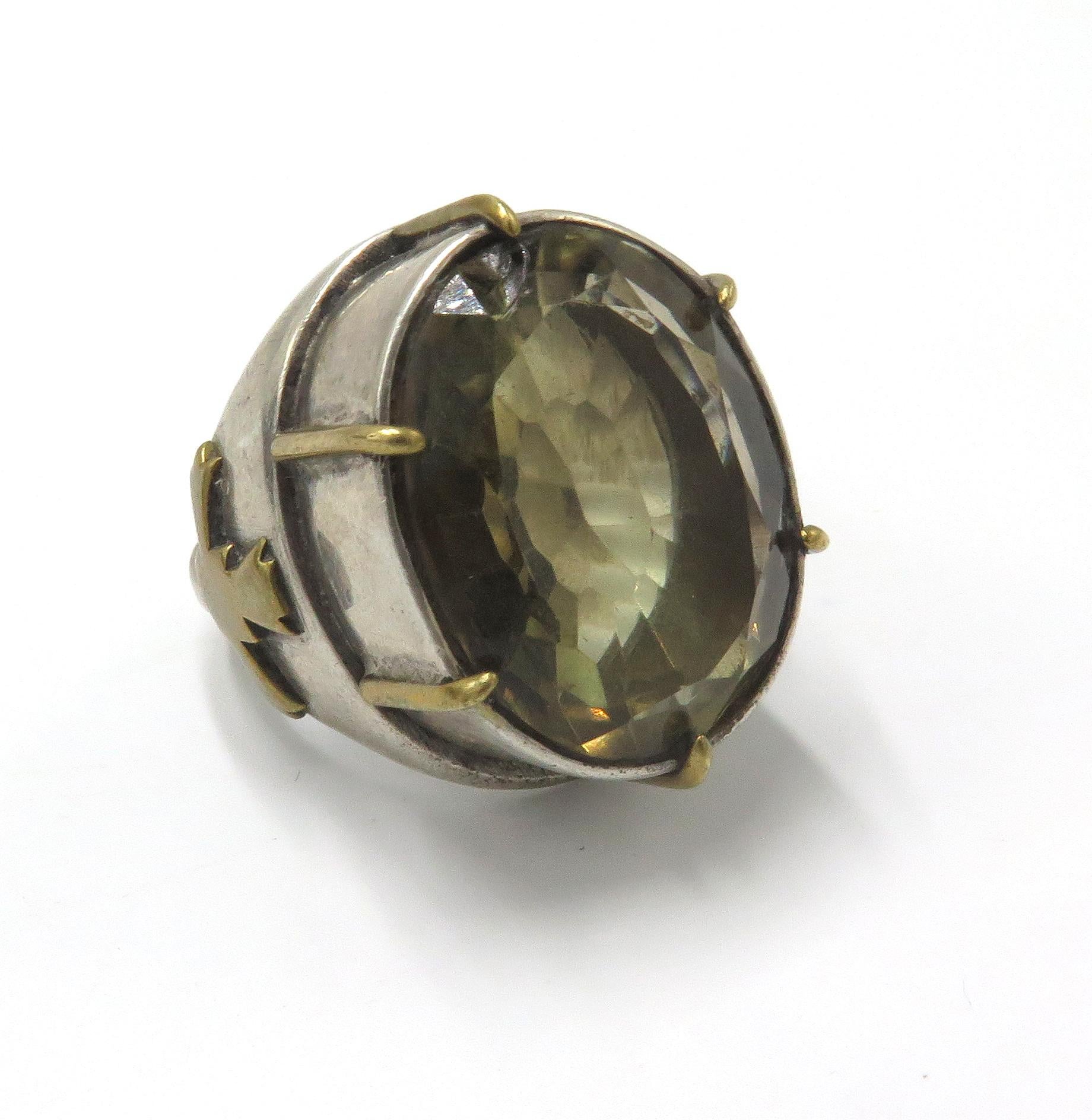 A, beautiful silver antique bishops rings. A, lovely bishops rings with beautiful gold accents and beautiful oval citrine. The, ring is crafted in silver but it include gold accents. On, the sides of each ring there a cross accent in gold. Around,