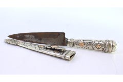 Silver-gold dagger w/ cutouts, floral motifs & Asian-style reliefs, steel blade