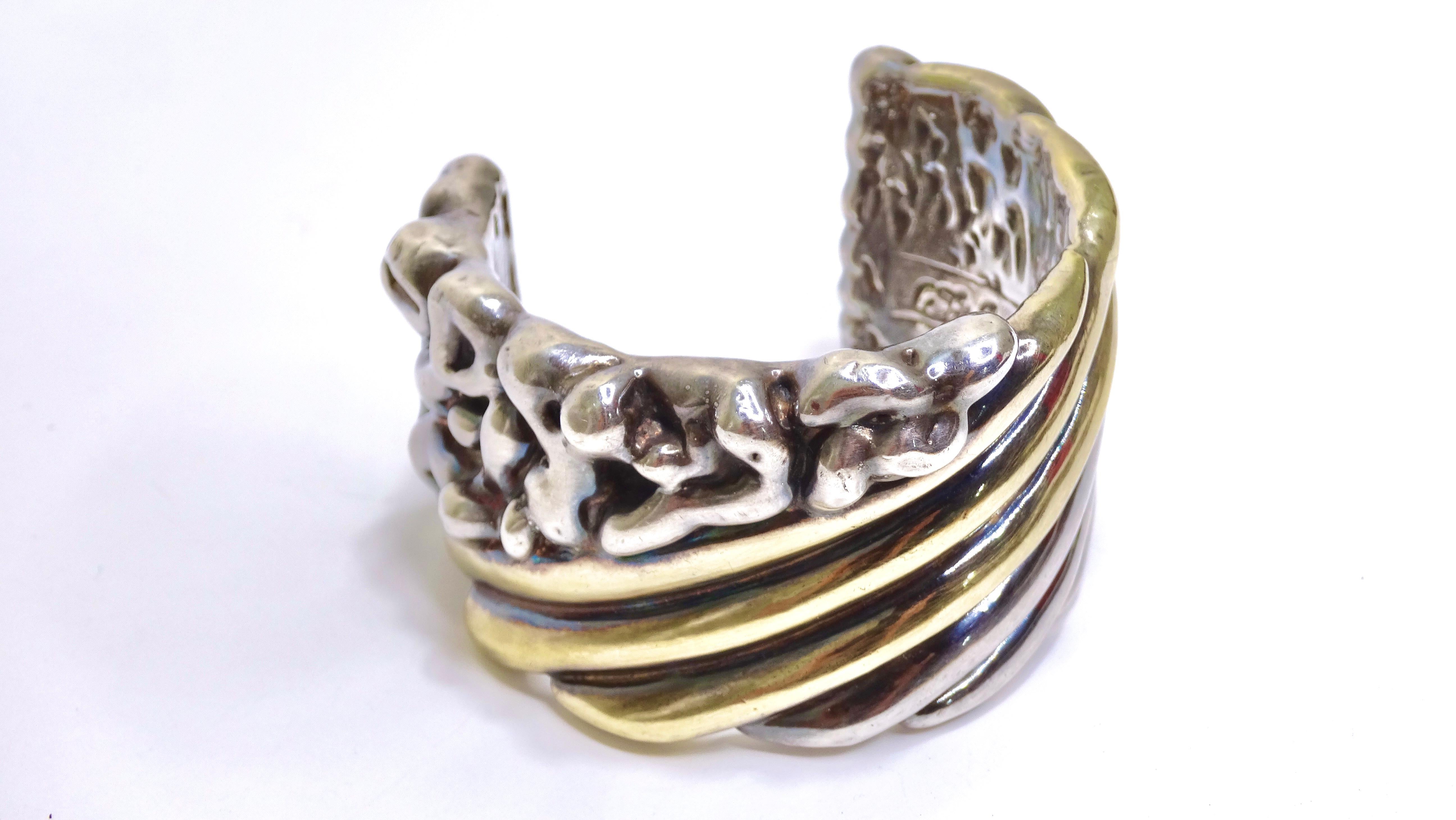 Feel fierce in one easy step! Add this super chunky and textured silver-metal accented with gold cuff to your jewelry collection. Circa 1960's and made in Israel, it features a rare hollow design which makes it light and easy to wear. Pair this