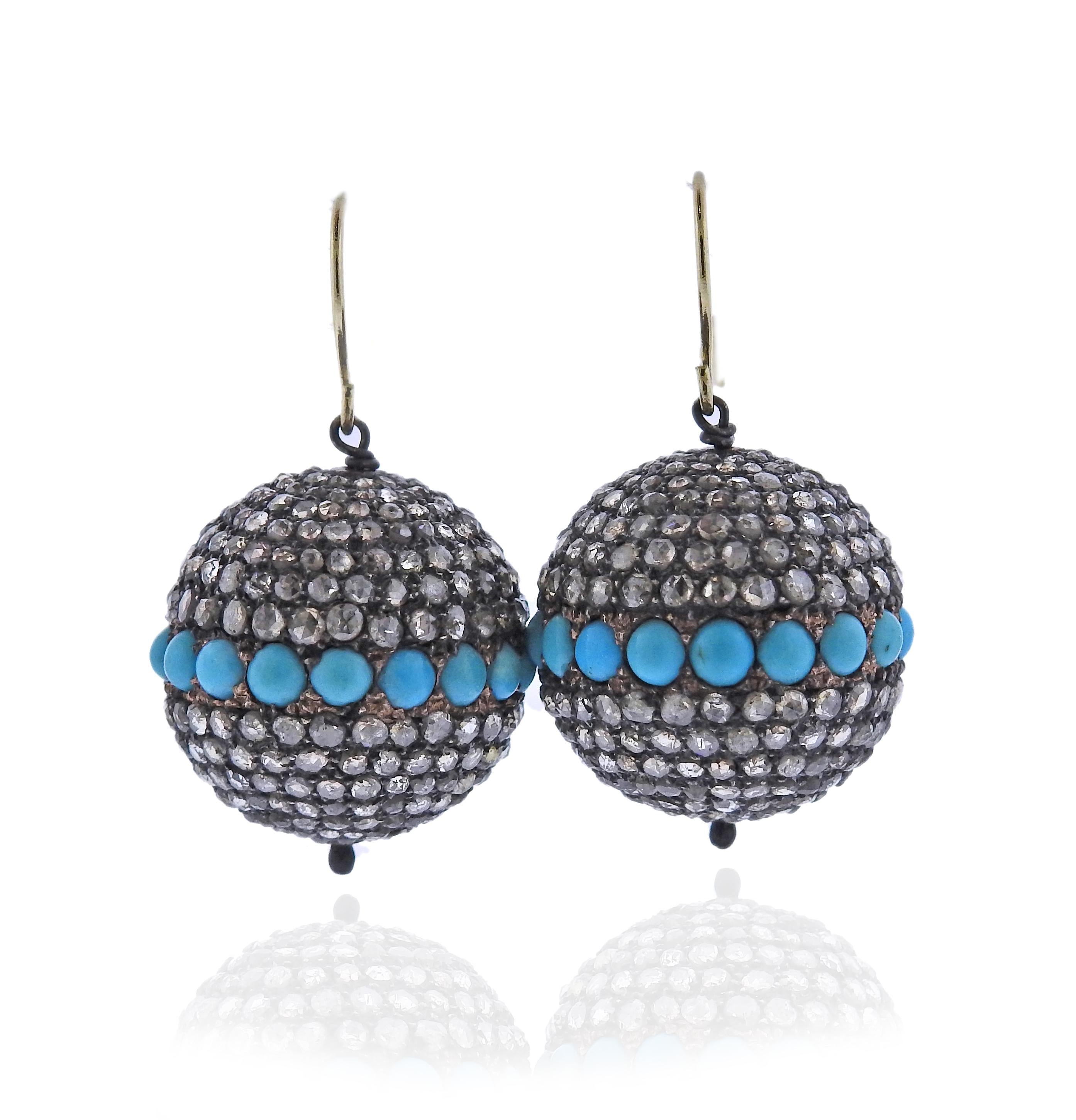 Pair of silver and 14k gold earrings with rose cut diamonds (one stone is missing) and turquoise. earrings are 33m m long, balls are 20mm in diameter. Weight 15.4 grams.