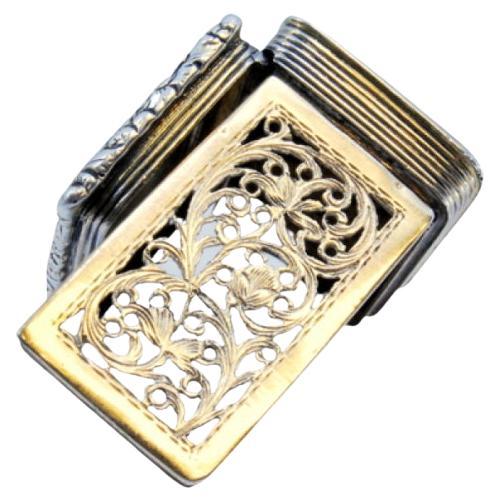 Silver-gold vinaigrette box with corded lid trim, George IV period