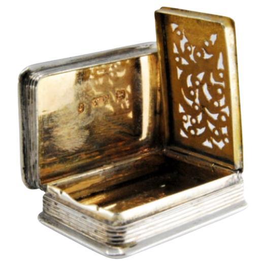 Silver-gold vinaigrette box with corded lid trim, George IV period