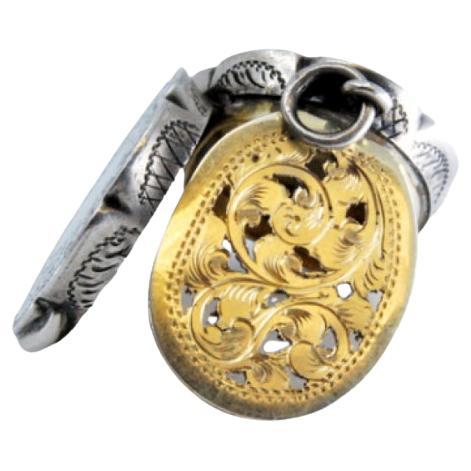 Silver-gold vinaigrette box with oval floral engraving, George VI period