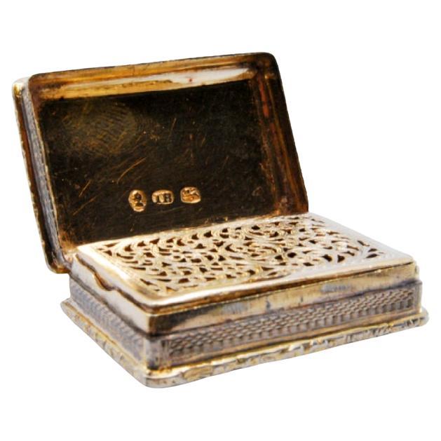 Silver-gold vinaigrette with grid interior 
beaded lid, George III