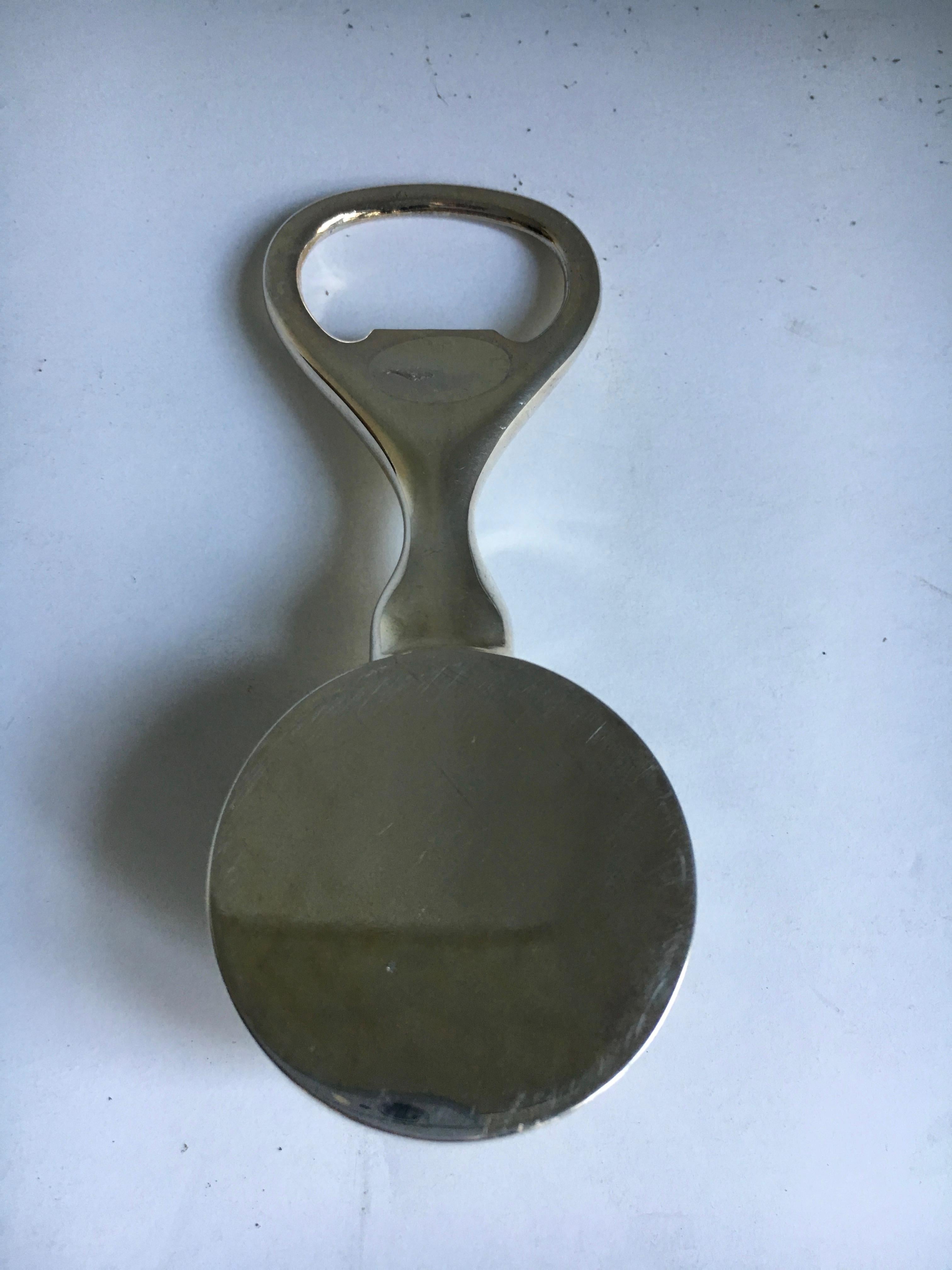 A very handsome bottle opener with golf ball handle - in excellent condition and perfect for the bar or office bar of the gold enthusiast. We have other golf related pieces - book ends, cocktail shaker - as us.
