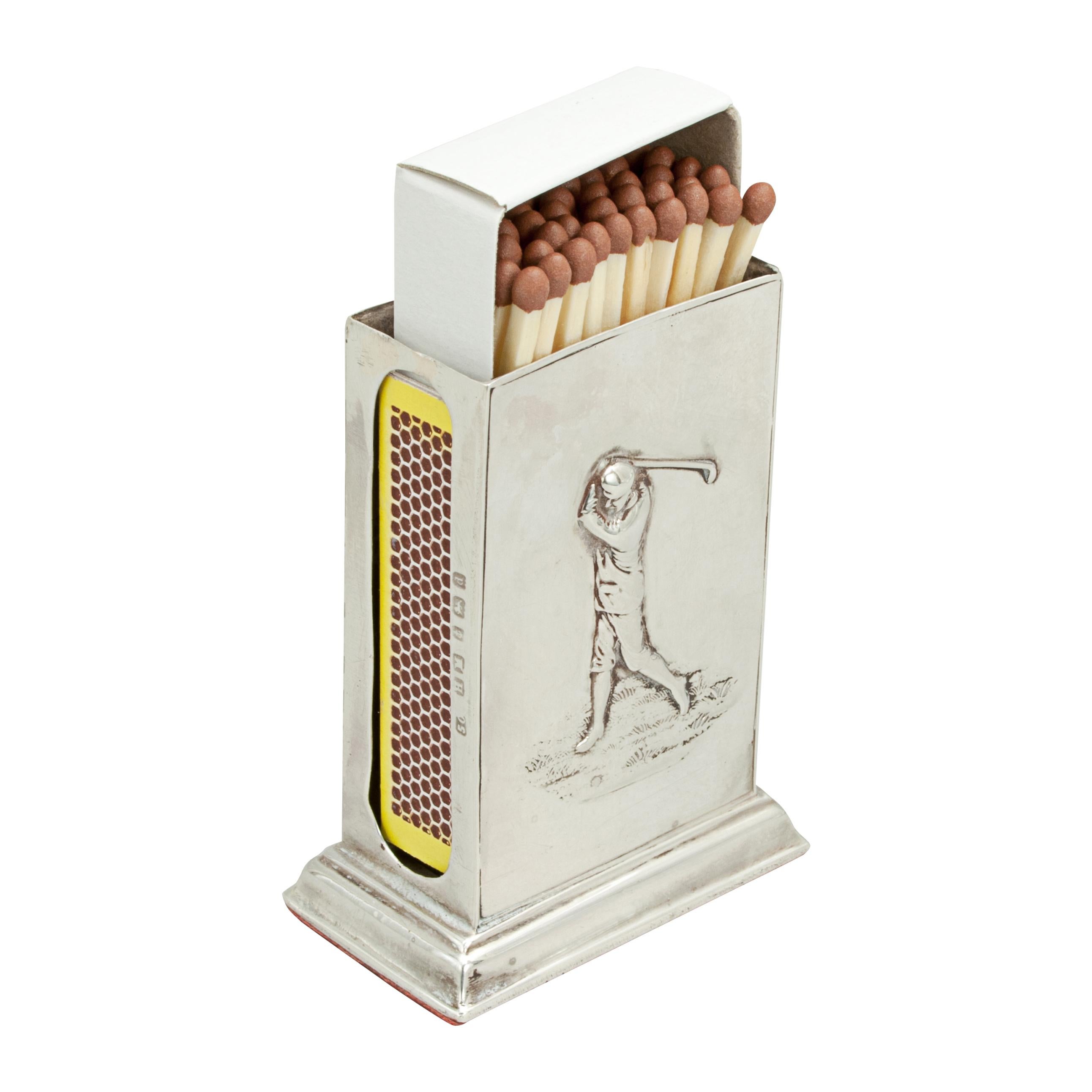 Golf matchbox holder.
Antique silver golfing matchbox holder. The matchbox holder is embossed with a golfing scene of a male golfer in his back swing. The match safe is hallmarked Birmingham, 1903. The sides are hollowed out so that you can strike
