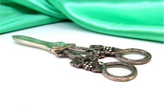 Silver grape scissors with vine and bunch reliefs on the handle
